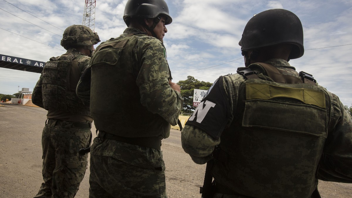 National Guards provide perimeter security at an immigration checkpoint in Arriaga, on Mexico's southern border, Sunday, June 23, 2019. Pressured by the U.S., Mexico’s government has deployed som ...