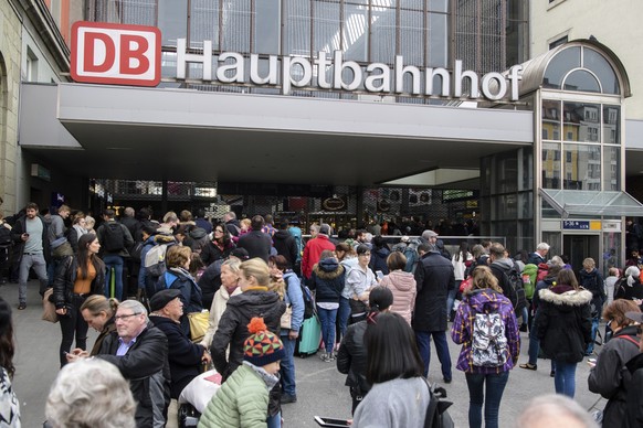 Travelers wait in front of the main train station in Munich, Germany, Wednesday, Oct. 31, 2018. Authorities investigating an &#039;ownerless bag&#039; at Munich train station and have partially evacua ...