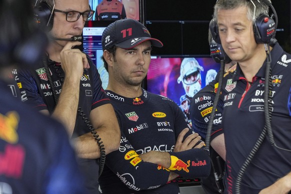 epa10877873 Mexican Formula One driver Sergio Perez of Red Bull Racing (C) prepares for the third practice session of the Japanese Formula One Grand Prix in Suzuka, Japan, 23 September 2023. The 2023  ...