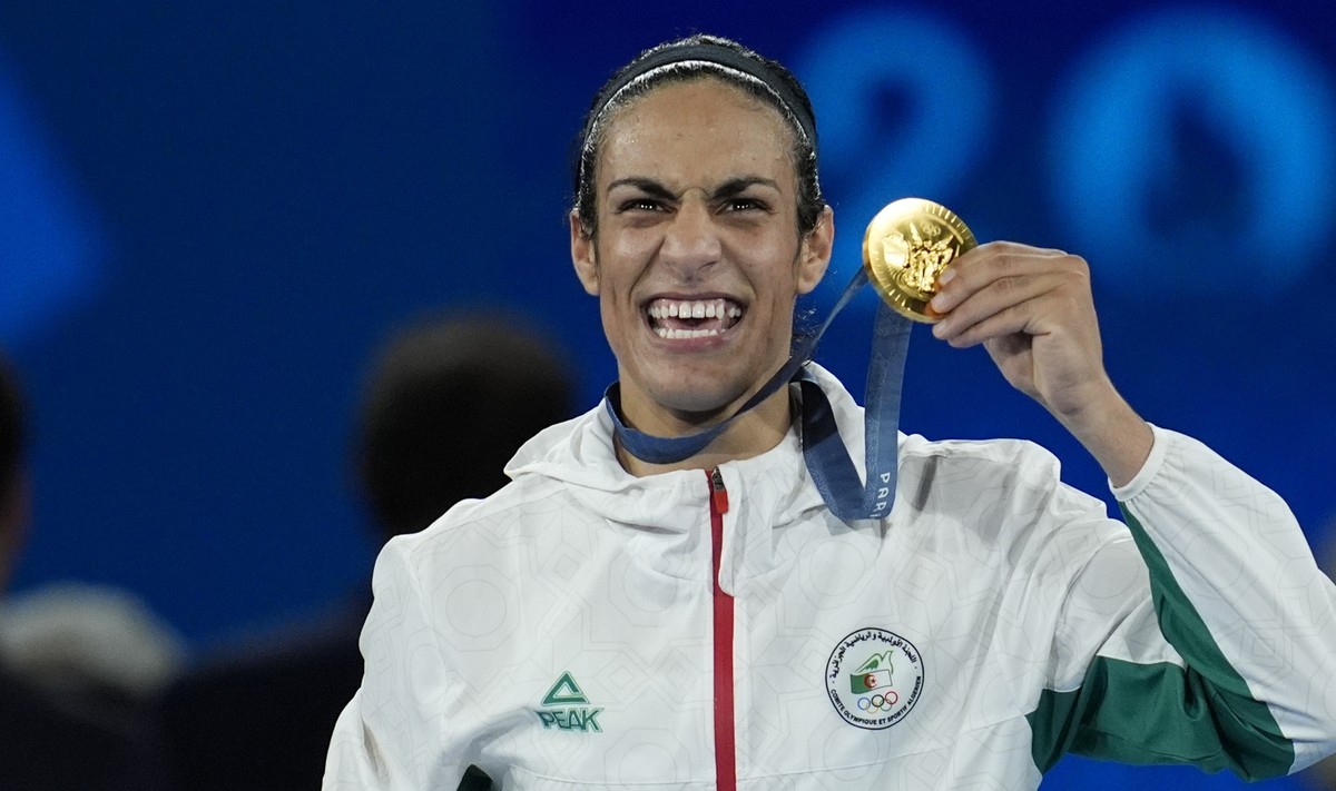 Gold medalist Algeria's Imane Khelif poses during a medals ceremony for the women's 66 kg final boxing match at the 2024 Summer Olympics, Friday, Aug. 9, 2024, in Paris, France. (AP Photo/Jo ...