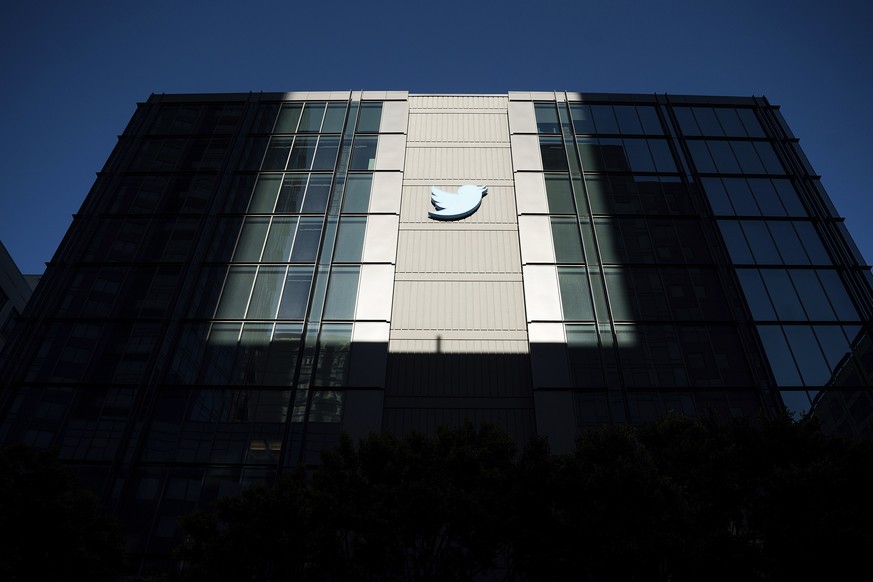 FILE - A Twitter logo hangs outside the company&#039;s San Francisco offices on Tuesday, Nov. 1, 2022. Reacting to the tumult and mass layoffs at Twitter under its new owner Elon Musk, a group of Demo ...