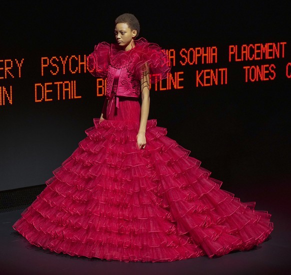 A model wears a creation as part of the Valentino Haute Couture Spring Summer 2025 collection, that was presented in Paris, Wednesday, Jan. 29, 2025. (AP Photo/Lewis Joly).