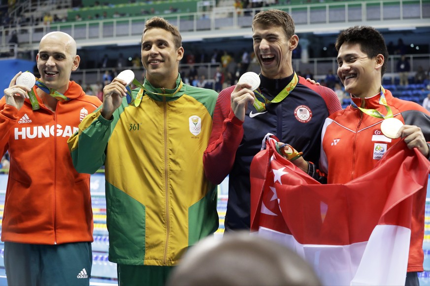 Silver medal winners Hungary&#039;s Laszlo Cseh, South Africa&#039;s Chad Le Clos and United States&#039; Michael Phelps and Singapore&#039;s gold medal winner Joseph Schooling, from left, celebrate i ...