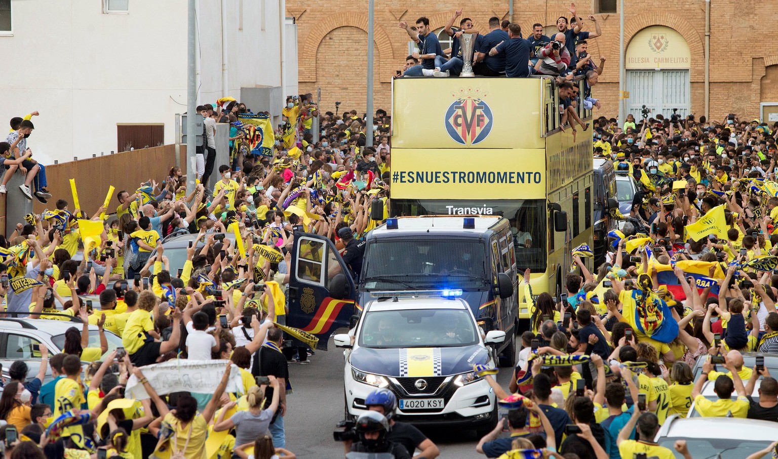 epa09231800 Villarreal&#039;s players celebrate during an open top bus parade together with their supporters in Villarreal, eastern Spain, 27 May 2021. Villarreal defeated Manchester United at the UEF ...