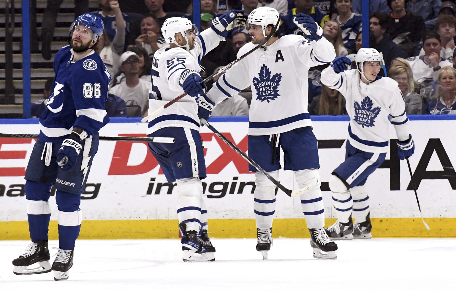 Toronto Maple Leafs defenseman Mark Giordano (55) and center Auston Matthews (34) celebrate Matthews&#039; second period goal during an NHL hockey game against the Tampa Bay Lightning Monday, April 4, ...