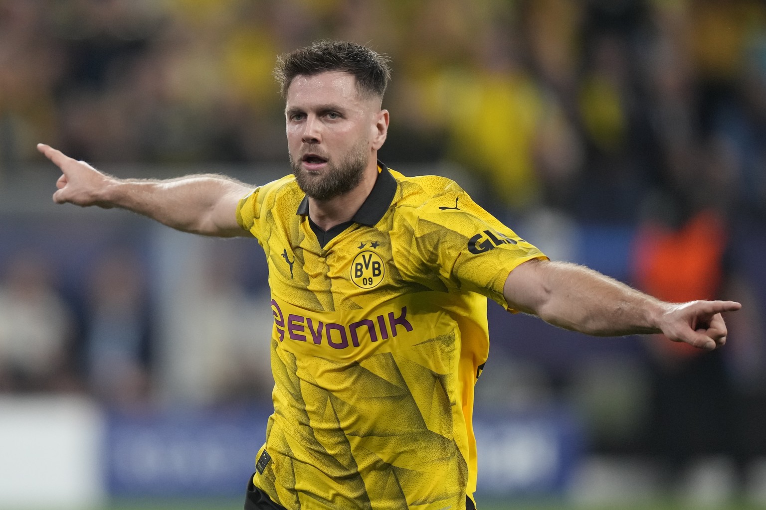 Dortmund&#039;s Niclas Fuellkrug celebrates after scoring his side&#039;s opening goal during the Champions League semifinal first leg soccer match between Borussia Dortmund and Paris Saint-Germain at ...