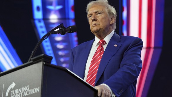 President-elect Donald Trump speaks at AmericaFest, Sunday, Dec. 22, 2024, in Phoenix. (AP Photo/Rick Scuteri)
