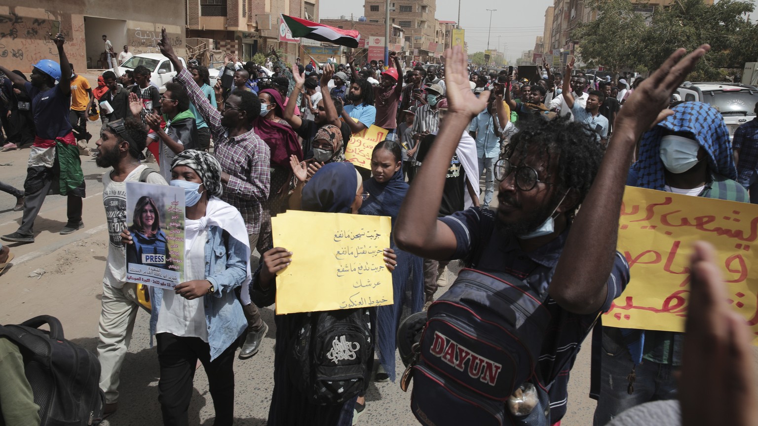 Sudanese protesters take part in a rally against military rule on the anniversary of previous popular uprisings, in Khartoum, Sudan, Thursday, May 12, 2022 . (AP Photo/Marwan Ali)