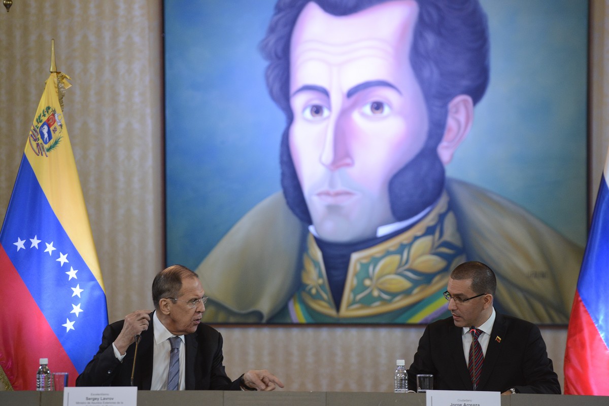 Russia's Foreign Minister Sergey Lavrov, left, talks to Venezuela's Foreign Minister Jorge Arreaza during a meeting to discuss bilateral issues in Caracas, Venezuela, Friday, Feb. 7, 2020. ( ...