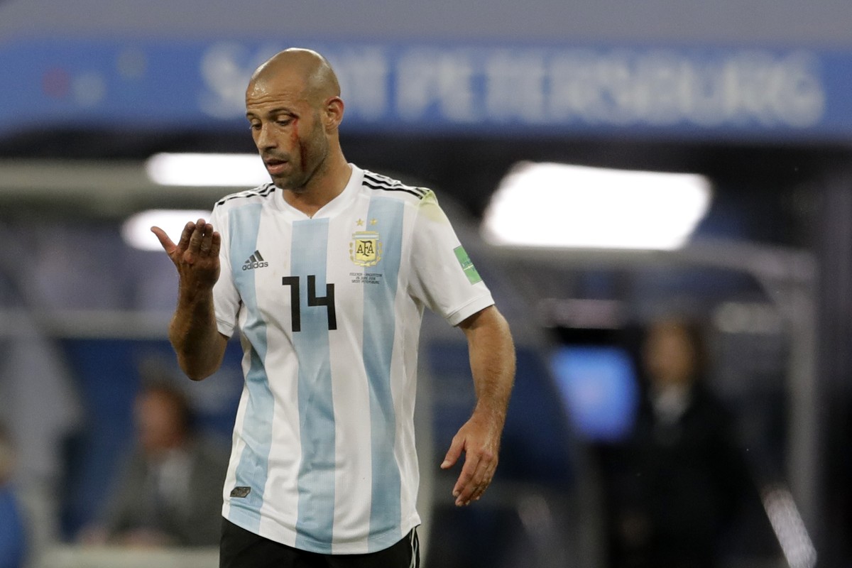 Argentina's Javier Mascherano reacts after an injuring during the group D match between Argentina and Nigeria, at the 2018 soccer World Cup in the St. Petersburg Stadium in St. Petersburg, Russia ...