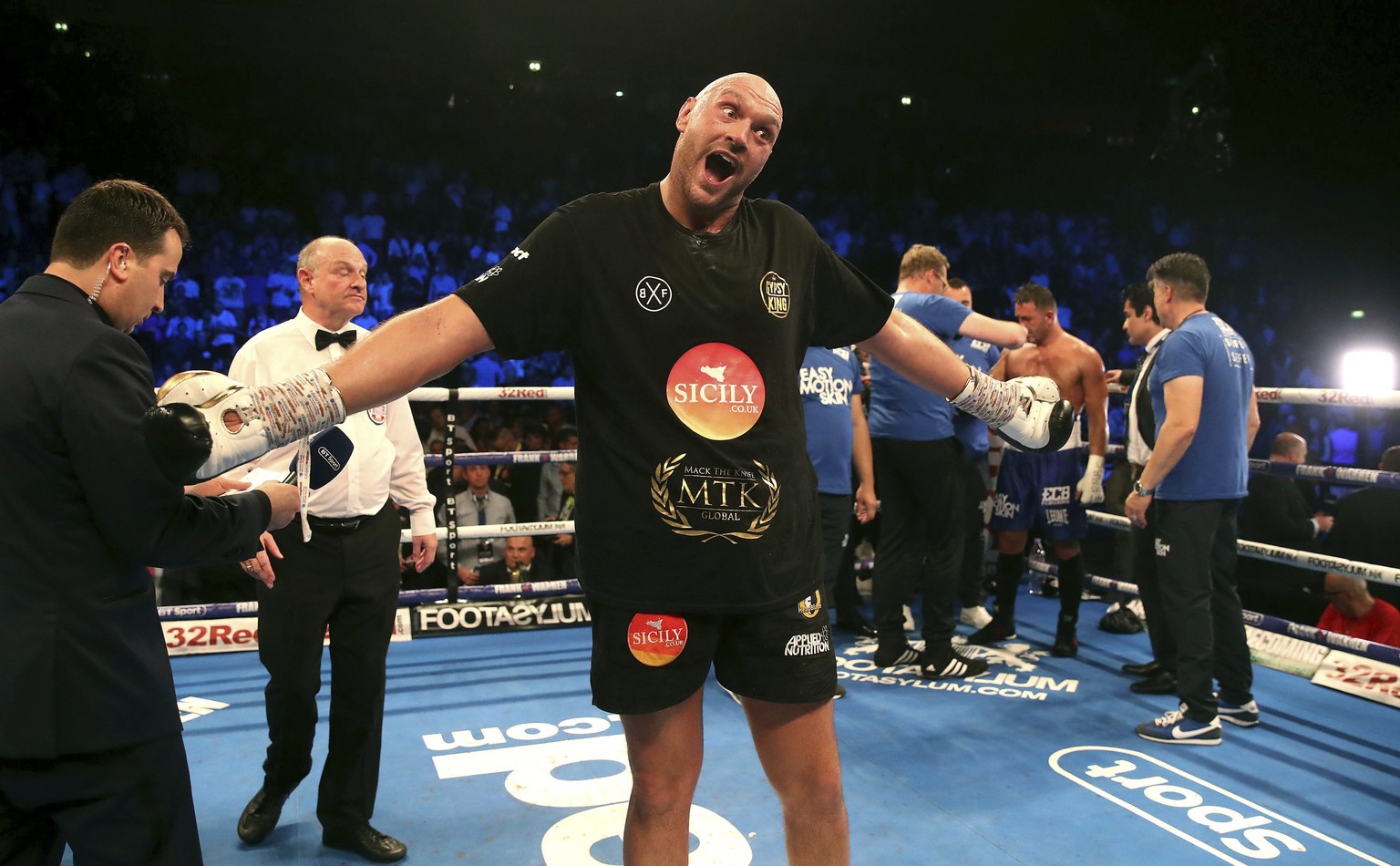 Britain&#039;s Tyson Fury, center, celebrates beating Sefer Seferi in their heavyweight bout at the Manchester Arena, in Manchester, England, Saturday June 9, 2018. (Nick Potts/ PA via AP)