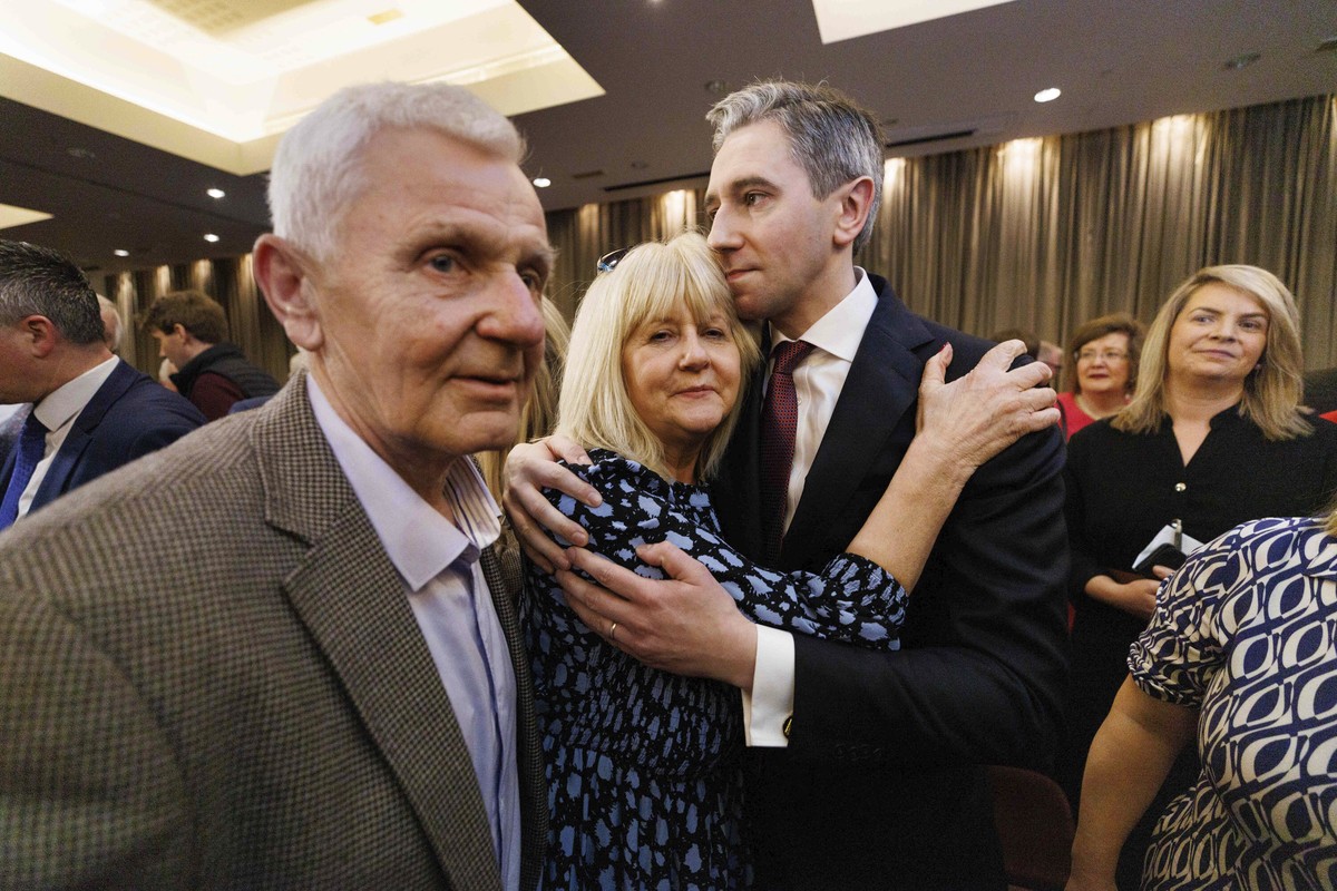 Simon Harris reacts with his parents Mary and Bart, after he was confirmed as the new leader of Fine Gael, paving the way for him to become Ireland's youngest premier, in Athlone, Ireland, Sunday ...