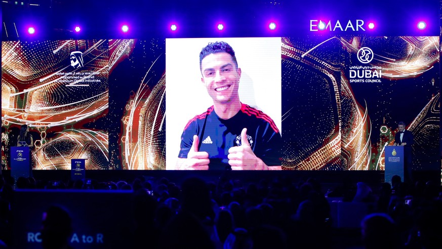 epa09658148 Portuguese soccer player Cristiano Ronaldo of Manchester United addresses the audience via a huge video screen regarding his &#039;Top Goal Scorer of all time&#039; award during the Dubai  ...