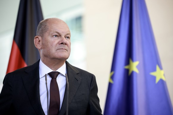 epa11568648 German Chancellor Olaf Scholz looks on during a joint press conference with British Prime Minister Keir Starmer (not pictured) at the chancellery in Berlin, Germany, 28 August 2024. Keir S ...