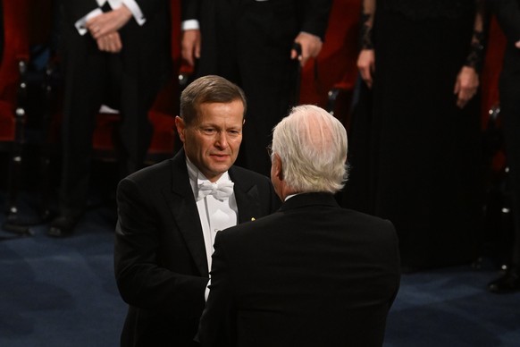 epa11021674 Hungarian physicist Ferenc Krausz receives the Nobel Prize in Physics 2023 from King Carl Gustaf (R) of Sweden during the Nobel Prize 2023 award ceremony at the Concert Hall in Stockholm,  ...