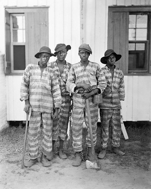 A chain gang in the southern US, circa 1903
https://en.wikipedia.org/wiki/Chain_gang#/media/File:A_Southern_chain_gang_c1903-restore.jpg