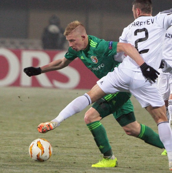 Forward Vladyslav Kulach (2nd LR) of FC Vorskla Poltava and defender Gara Garayev (R) of Qarabag FK are seen in action during the UEFA Europa League Matchday 4 Group E game at the Oleksiy Butovsky Vor ...