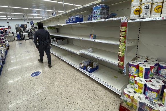 A view of empty shelves at a supermarket in London, Monday, Sept. 20, 2021. Retailers, manufacturers and food suppliers have reported disruptions due to a shortage of truck drivers linked to the pande ...