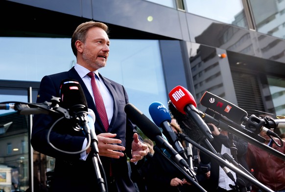 epa09499749 Christian Lindner, lead candidate of the German Free Democrats (FDP), answers media questions after exploratory talks in Berlin, Germany, 01 October 2021. Greens and FDP met in search for  ...