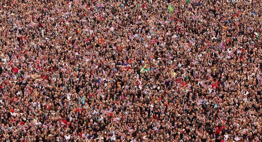 A general view of the crowd in the Mall and around the Victoria Memorial filled with well-wishers celebrating the Royal Wedding of Prince William, Duke of Cambridge and Catherine, Duchess of Cambridge ...