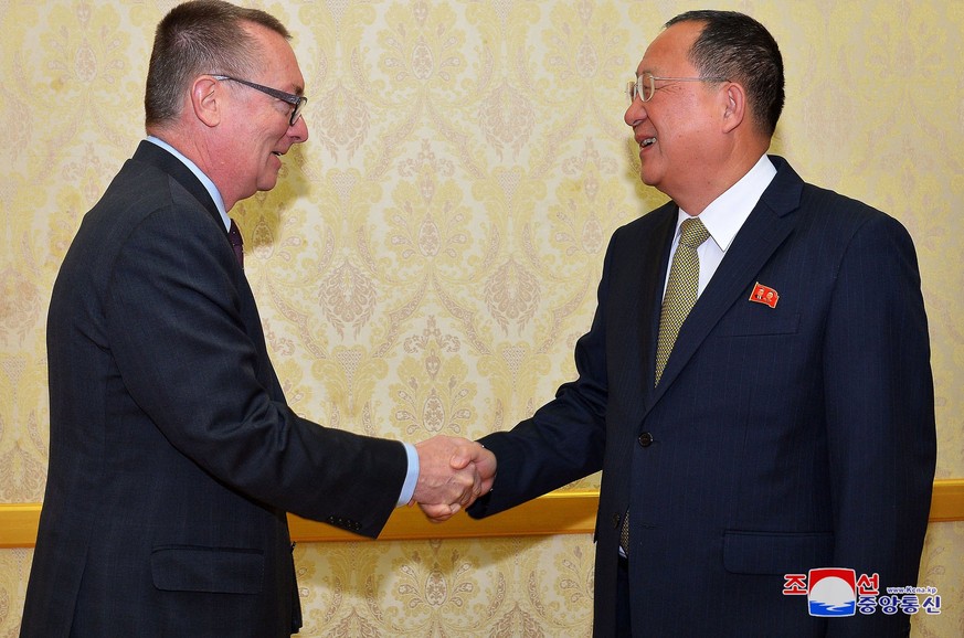 epa06375483 A photo released by the North Korean Central News Agency (KCNA), the state news agency of North Korea, shows North Korean Foreign Minister Ri Yong-ho (R) greeting UN Undersecretary-General ...