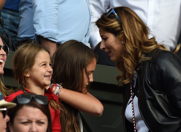 epa05394883 Roger Federer&#039;s wife Mirka and her daughters on Centre Court as her husband takes on Guido Pella of Argentina during their first round match of the Wimbledon Championships at the All  ...