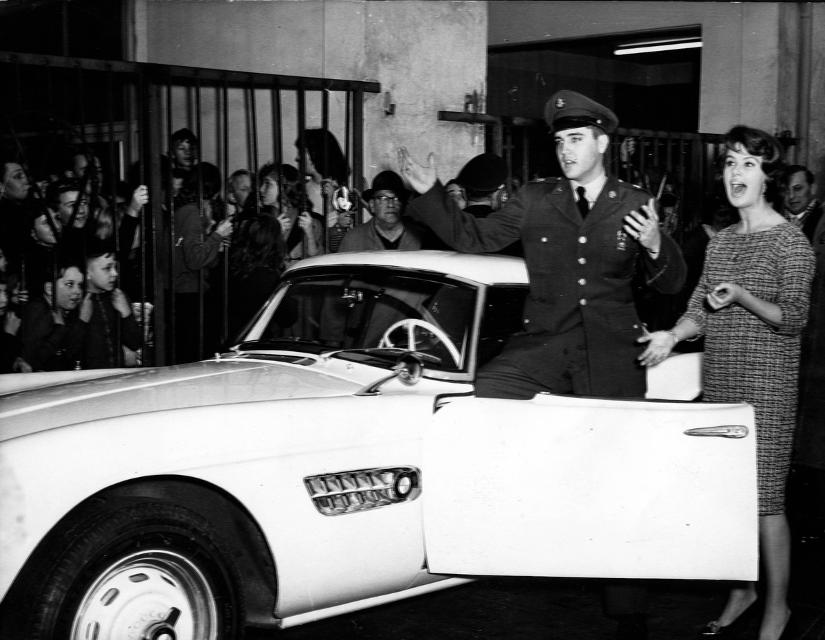 Dec 22, 1958; Frankfurt, GERMANY; Hundreds of fans gather when Uschi Siebert, a television assistant of H.J. Kulenkampff, gave ELVIS PRESLEY the keys of a snow-white BMW sports car and wished him a go ...