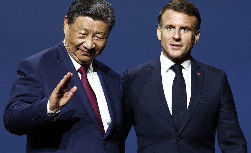epa11322639 French President Emmanuel Macron and Chinese President Xi Jinping (L) leave the sixth meeting of the Franco-Chinese Business Council at the Marigny Theater in Paris, France, 06 May 2024. C ...