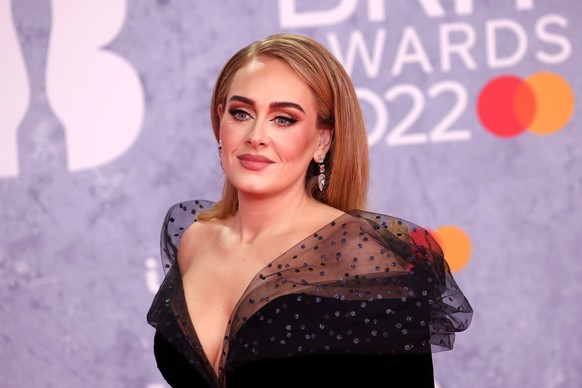 epa09739208 Adele arrives for the 42nd Brit Awards ceremony at The O2 Arena in London, Britain, 08 February 2022. The annual pop music awards are presented by the British Phonographic Industry (BPI).  ...