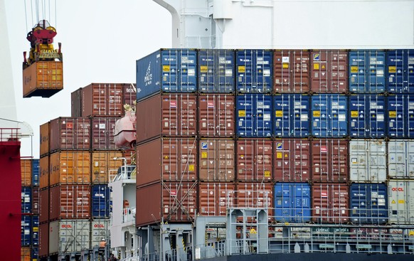 FILE - In this Aug. 5, 2010, file photo, a container is loaded onto a cargo ship at the Tianjin port in China. The United States is joining a fight against China at the World Trade Organization in a d ...