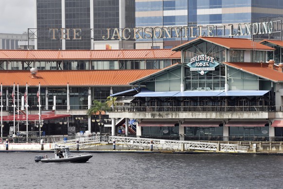 Law enforcement boats patrol the St. Johns River at the scene of a multiple shooting at the Jacksonville Landing Sunday, Aug. 26, 2018 in Jacksonville, Fla. A gunman opened fire Sunday during an onlin ...