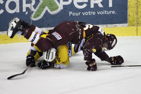 Geneve-Servette&#039;s forward Noah Rod #96 clashs against Bern&#039;s defender Adam Almquist #5, of Sweden, during the second leg of the playoffs quarterfinals game of National League Swiss Champions ...