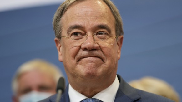 Armin Laschet, the top CDU candidate grimaces after the German parliament elections at the Christian Democratic Union, CDU, party&#039;s headquarters in Berlin, Sunday, Sept. 26, 2021. German voters a ...