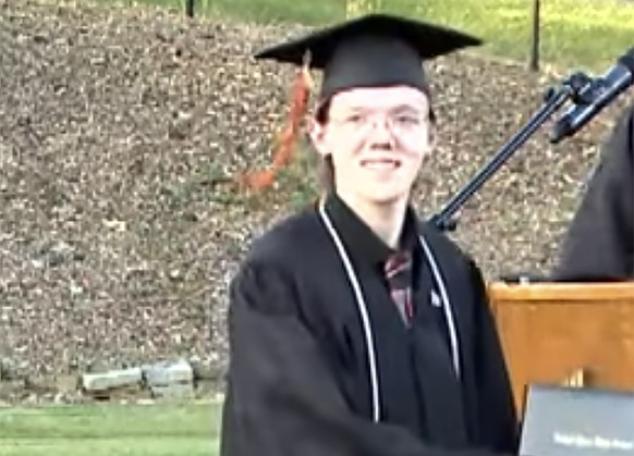 This June 3, 2022 still image taken from video provided by the Bethel Park School District shows student Thomas Matthew Crooks in the 2022 Bethel Park High School Commencement in Bethel Park, Pa. (The ...