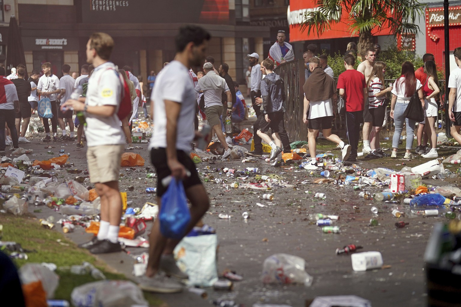 Piles of rubbish left behind by partying England fans in Leicester Square central London, Sunday July 11, 2021, ahead of the Euro 2020 soccer championship final match between England and Italy, at Wem ...