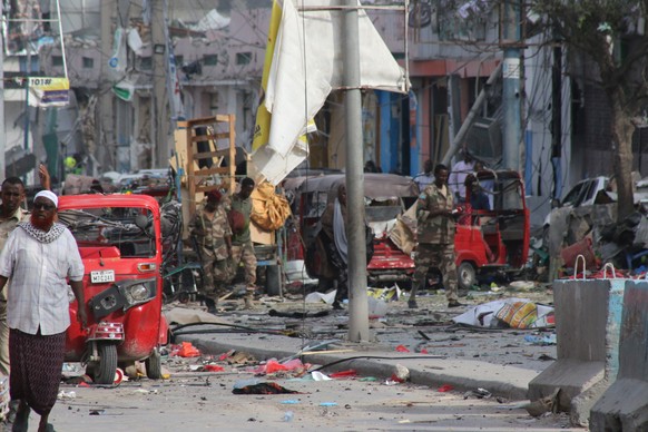epa10273187 A general view of the scene in Mogadishu, Somalia, 29 October 2022, after two car bombs exploded at a busy junction in near key government offices, leaving scores of civilian casualties, a ...