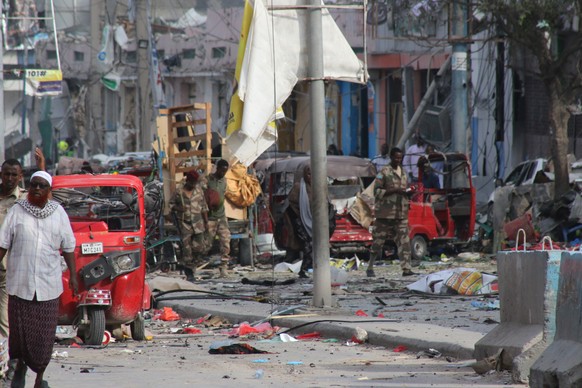 epa10273187 A general view of the scene in Mogadishu, Somalia, October 29, 2022, after two car bombs exploded at a busy intersection near key government offices, killing dozens of civilians, a…