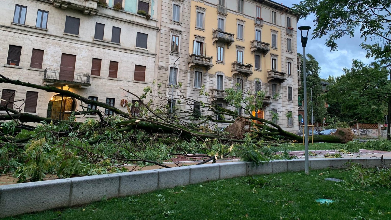 epa10767082 The aftermath of a storm which was accompanied by continuous discharges of lightning and sudden gusts of wind, in Milan, Italy, 25 July 2023. EPA/Luca Pinardi