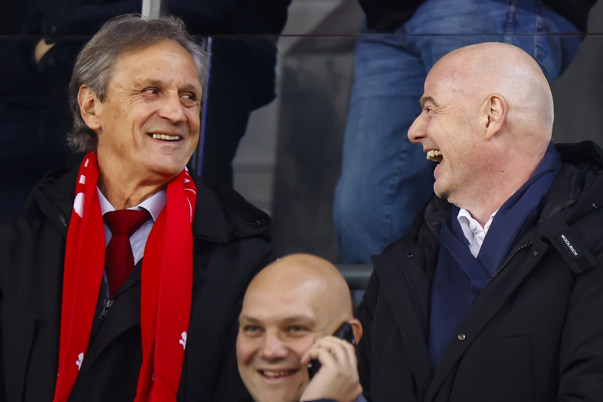 FIFA President Gianni Infantino, right, talks to Switzerland's soccer federation president Dominique Blanc, left, before the UEFA Nations League soccer match between Switzerland and Serbia at the ...
