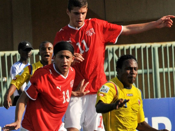 Switzerland's Ricardo Rodriguez, left, and Granit Xhaka challenge Colombia's Wilson Cuero during their U17 World Cup semi-final soccer match Lagos, Nigeria Thursday, Nov. 12, 2009. (AP Photo ...