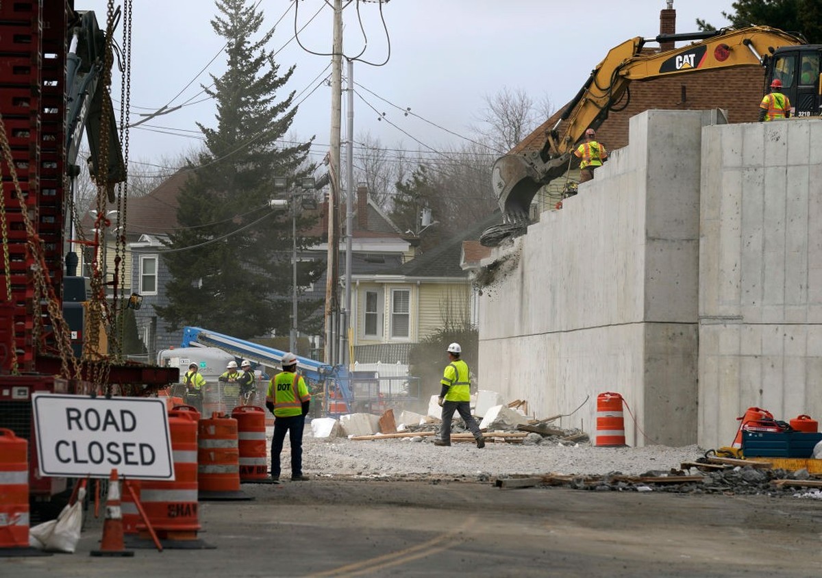 PORTLAND, ME APRIL 23: With the steel beams of the old I-295 bridge over Veranda Street removed, workers clear debris from the bridge abutments on Saturday morning. (Staff photo by Gregory Rec/Portlan ...