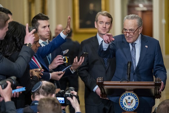 epa11185391 US Senate Majority Leader Chuck Schumer (R) responds to a question from the news media during a press conference in the US Capitol in Washington, DC, USA, 27 February 2024. President Biden ...