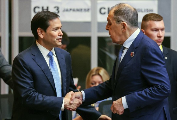 epa12230741 Russia&#039;s Foreign Minister Sergei Lavrov (R) greets US Secretary of State Marco Rubio (L) during the 15th East Asia Foreign Ministers? Meeting at the 58th Association of Southeast Asia ...