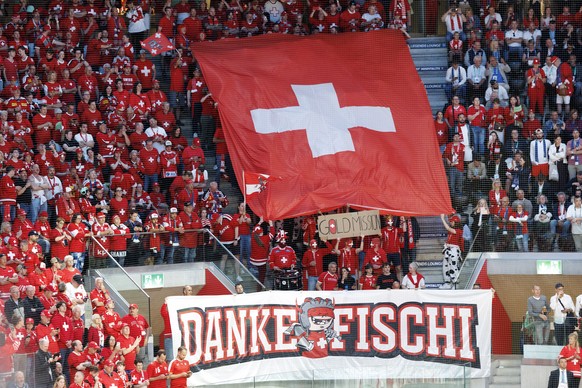 Switzerland's supporters hold a banner with "Danke Fischi (for Patrick Fischer) before the 2026 IIHF Men's Ice Hockey World Championship gold medal game between Switzerland and Finland, ...