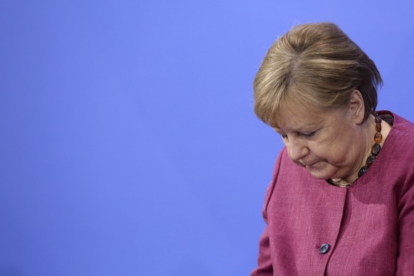 epa09231645 German Chancellor Angela Merkel (CDU) attends a press conference after talks on the country&#039;s coronavirus strategy as the pandemic continues, in the German federal Chancellery in Berl ...