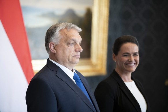 epa09972034 A handout photo made available by the Hungarian Prime Minister&#039;s Press Office shows Hungarian President Katalin Novak (R) and Prime Minister Viktor Orban take part in the handover cer ...