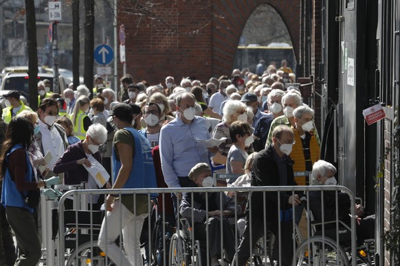 File- In this Wednesday, March 31, 2021 file photo, people line up in front of the vaccination center at the Arena Treptow in Berlin, Germany. Germany&#039;s health minister Jens Spahn says today the  ...