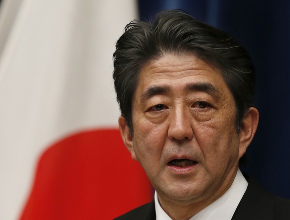 FILE - Then Japan&#039;s new Prime Minister Shinzo Abe speaks during his first press conference at the prime minister&#039;s official residence in Tokyo Wednesday, Dec. 26, 2012. Former Japanese Prime ...