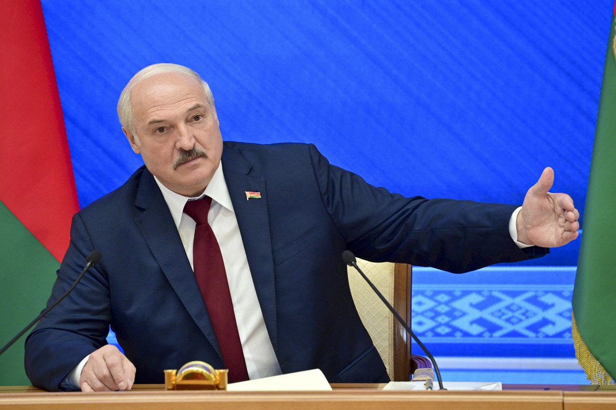 Belarusian President Alexander Lukashenko gestures while speaking during an annual press conference in Minsk, Belarus, Monday, Aug. 9, 2021.Belarus' authoritarian leader on Monday charged that th ...