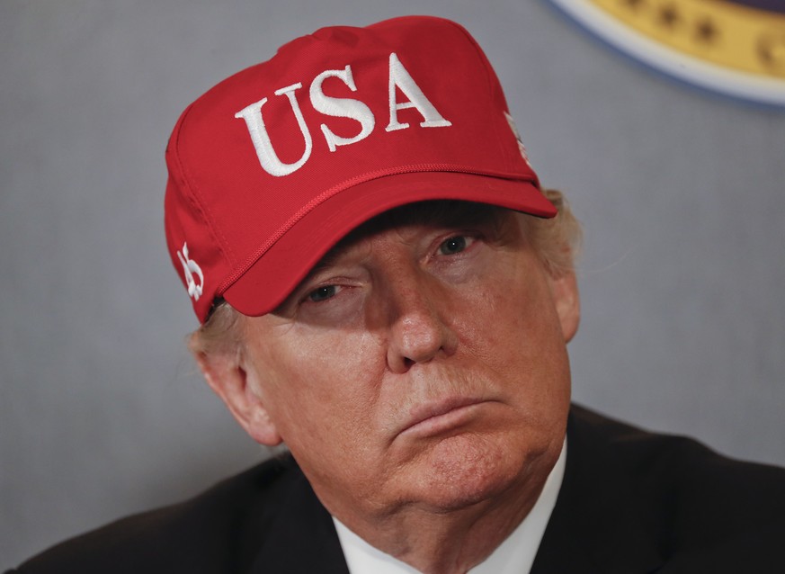 FILE - In this March 2, 2017, file photo, President Donald Trump listens during a briefing on nuclear aircraft carrier Gerald R. Ford at Newport News Shipbuilding in Newport, Va. TrumpÄôs vision of A ...